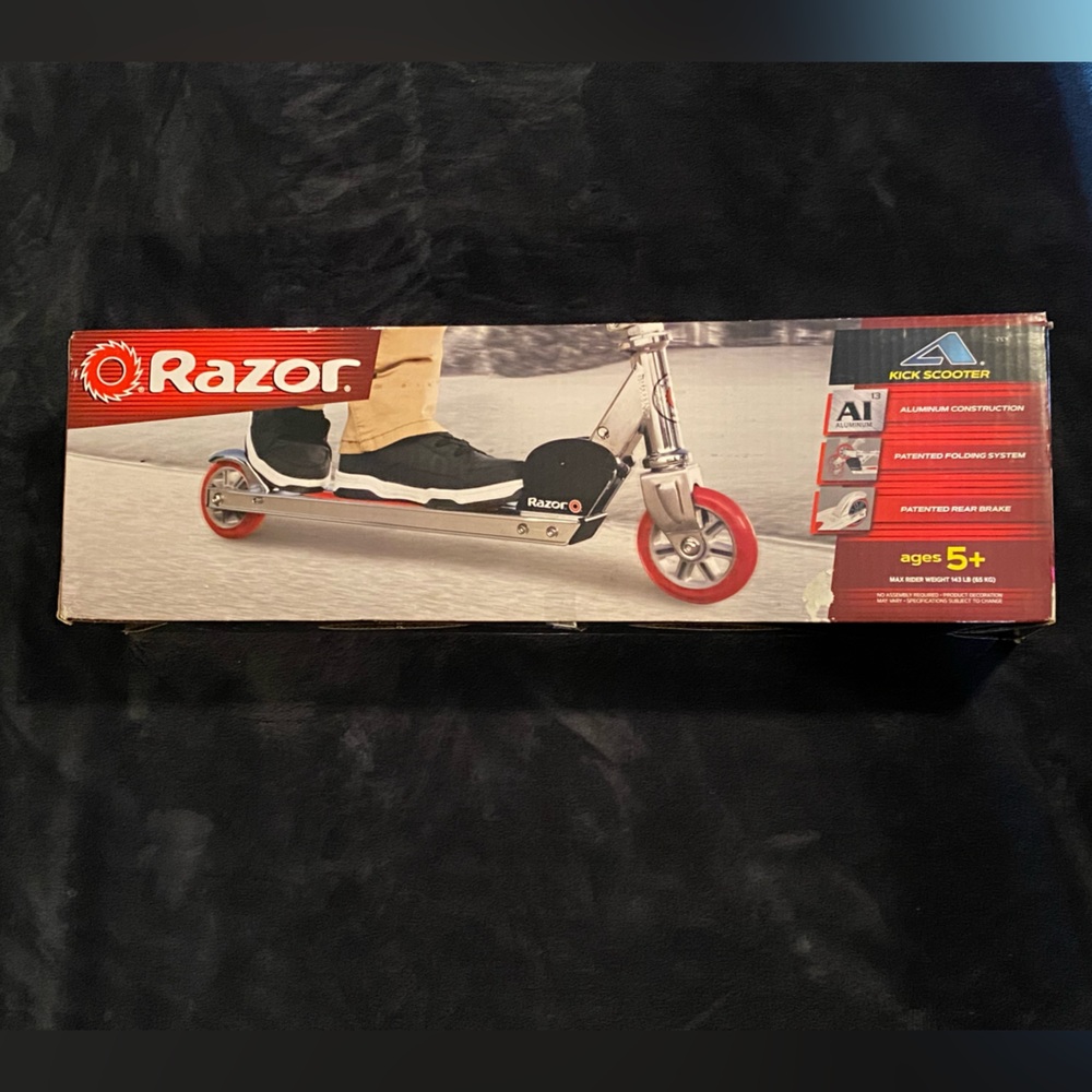 Razor Foldable Kick Scooter in Silver with Red Wheels
